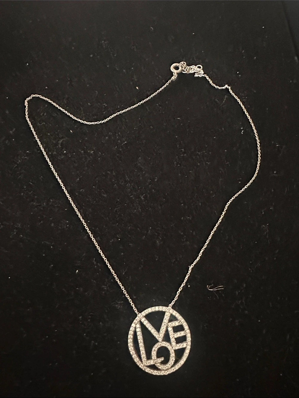Silver toned crystal LOVE necklace